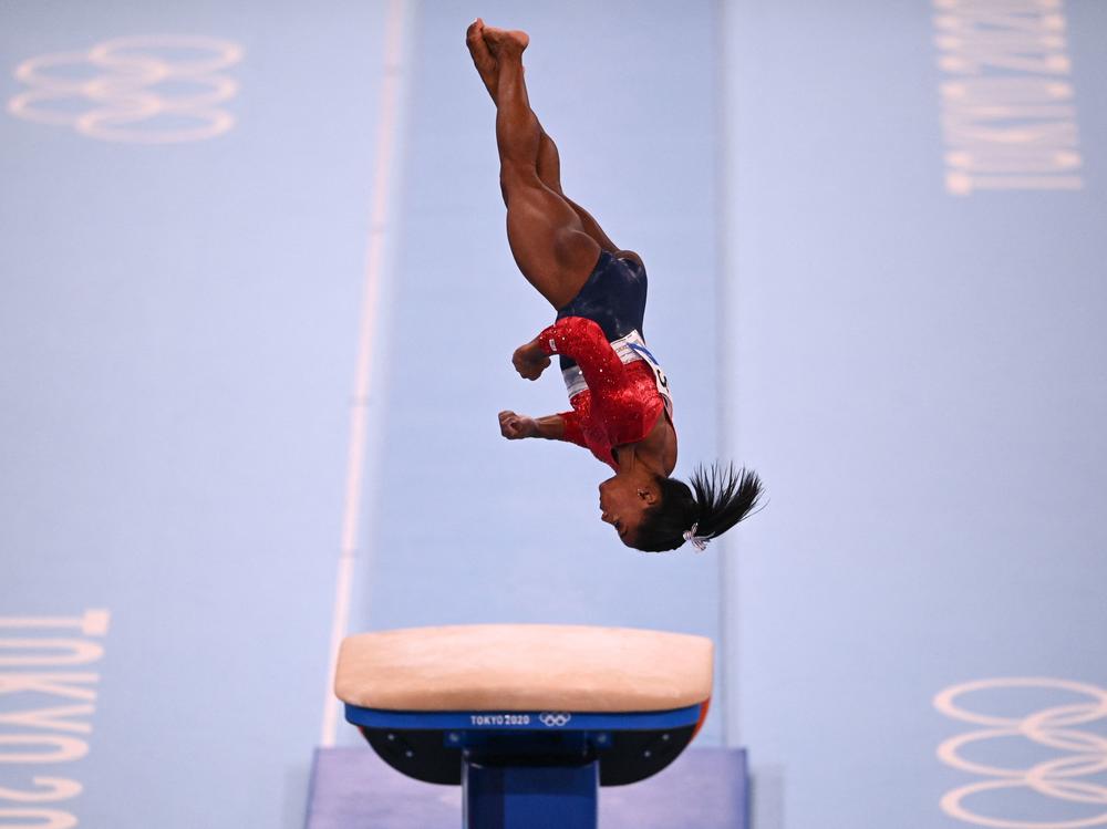 Biles competes in the vault event of the women's gymnastics team final before withdrawing during the Tokyo Olympics on Tuesday.