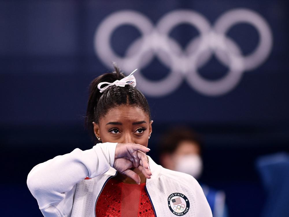 Simone Biles looks on during the women's gymnastics team final during the Tokyo Olympics on Tuesday. After competing on the vault, Biles withdrew from team competition.