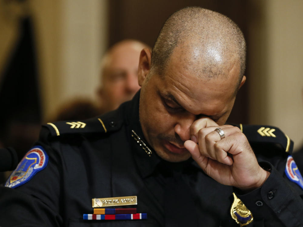 U.S. Capitol Police Sgt. Aquilino Gonell wipes tears while testifying Tuesday during the opening hearing of the House select committee investigating the Jan. 6 attack on the U.S. Capitol.