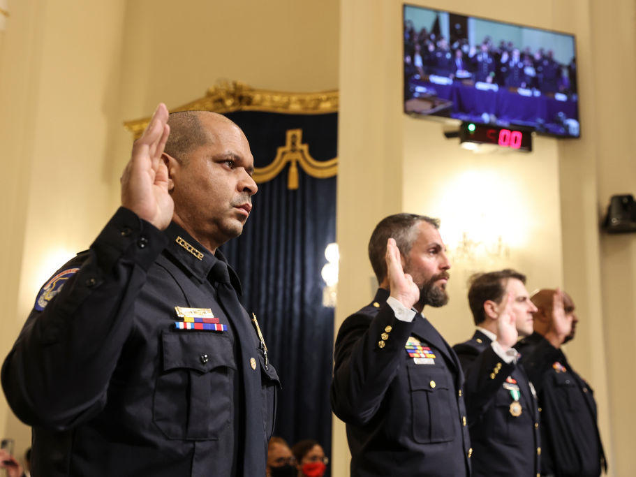 U.S. Capitol Police Sgt. Aquilino Gonell (from left), officers Michael Fanone and Daniel Hodges of the Washington, D.C., Metropolitan Police Department, and Capitol Police Pfc. Harry Dunn are sworn in Tuesday before testifying before the House select committee investigating the Jan. 6 attack.