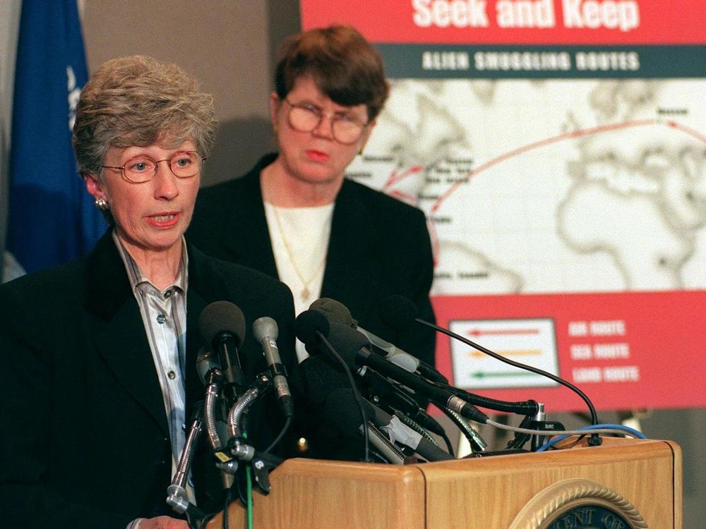 Then-Immigration and Naturalization Service Commissioner Doris Meissner (left) discusses immigration with reporters on Nov. 20, 1998.