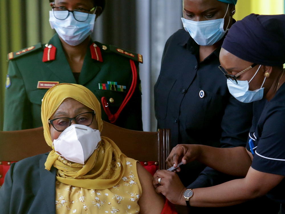 Tanzania's President Samia Suluhu Hassan receives her Johnson & Johnson vaccine against the coronavirus at the statehouse in Dar es Salaam on July 28. Her administration has reversed the government's anti-vaccination stance.