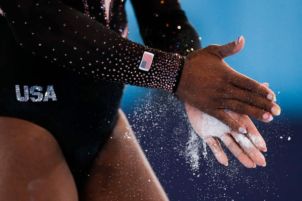 Simone Biles of the United States chalks her hands while training on vault for artistic gymnastics at Ariake Gymnastics Centre venue ahead of the 2020 Summer Olympics, Thursday, July 22, 2021, in Tokyo, Japan.