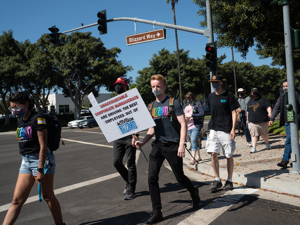 Employees walk across Blizzard Way during a walkout at Activision Blizzard offices in Irvine, Calif., on Wednesday.