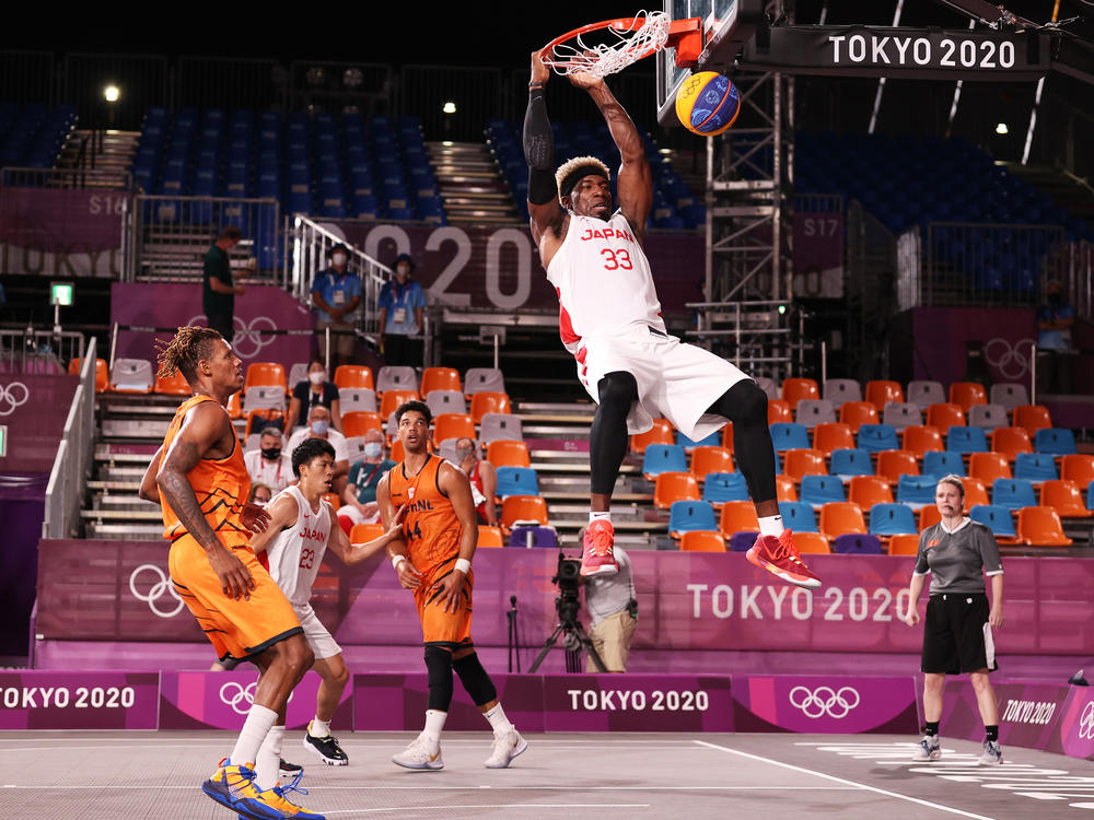 Ira Brown of Team Japan slam dunks during the Men's Pool Round match between Japan and Netherlands on Sunday during the Tokyo 2020 Olympic Games at Aomi Urban Sports Park.