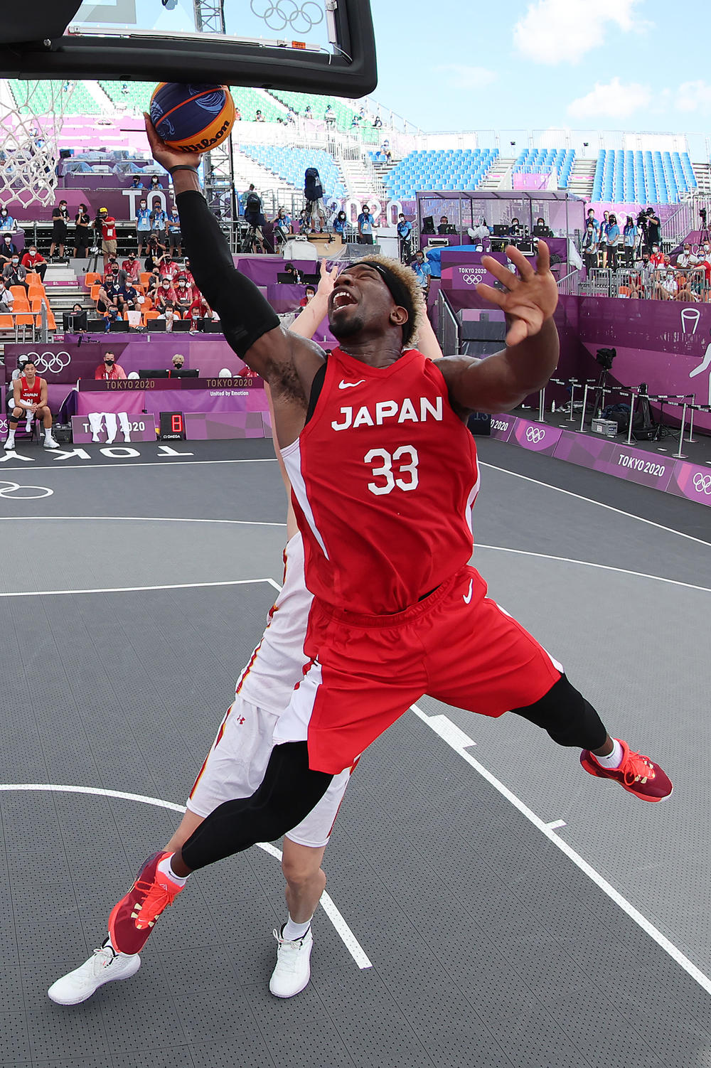 Ira Brown of Team Japan drives to the basket in the 3x3 Basketball competition on Tuesday at the Tokyo 2020 Olympic Games.
