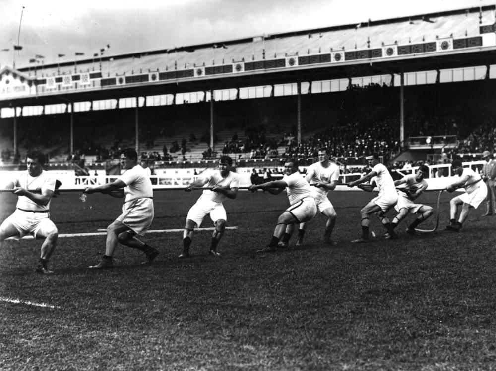 The Unites States tug-of-war team in action during the 1908 London Olympics at White City Stadium.