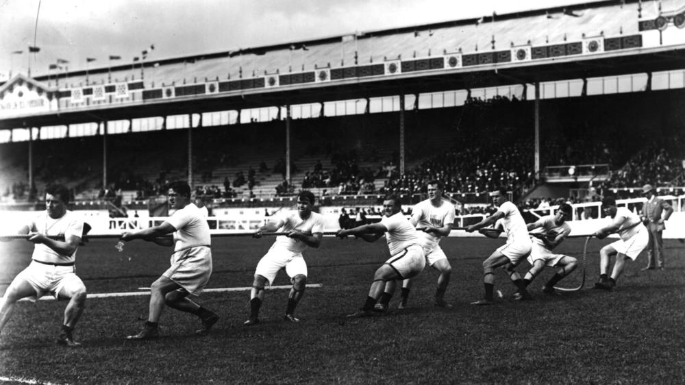 The Unites States tug-of-war team in action during the 1908 London Olympics at White City Stadium.