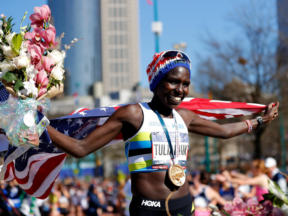 Aliphine Tuliamuk poses after winning the women's U.S. Olympic marathon team trials in February 2020 in Atlanta.
