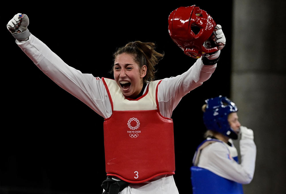 U.S.'s Anastasija Zolotic celebrates winning against Russia's Tatiana Minina in the taekwondo women's 57kg gold medal bout on July 25, 2021.