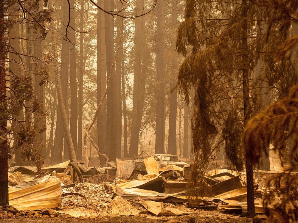 The remains of a burned home are seen in the Indian Falls neighborhood of unincorporated Plumas County, California on July 26, 2021. Extreme weather events have claimed hundreds of lives worldwide in recent weeks, and upcoming forecasts for wildfire and hurricane seasons are dire.