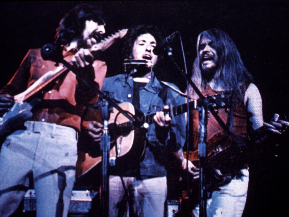 George Harrison, Bob Dylan and Leon Russell perform at the Concert for Bangladesh in 1971.
