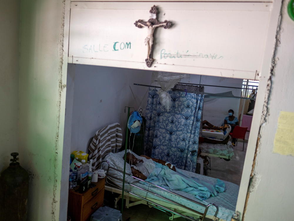 COVID-19 patients receive treatment at the St. Luke Foundation for Haiti hospital in Port-au-Prince, Haiti, on July 16. The country received its first shipment of COVID-19 vaccine doses that month.