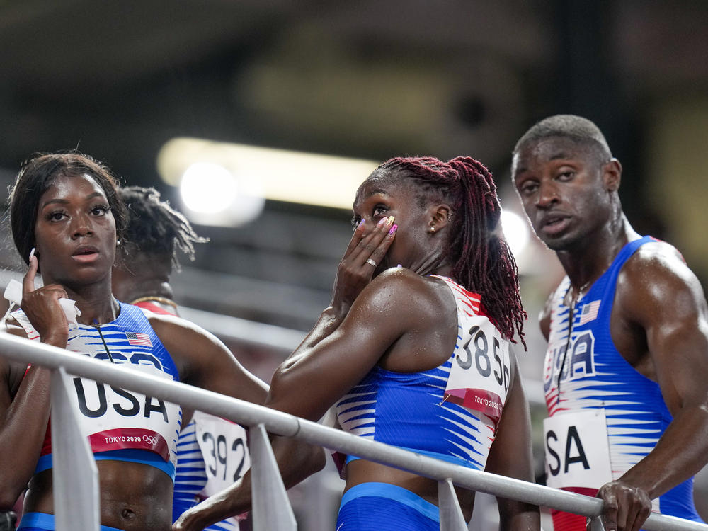 U.S. sprinter Lynna Irby wipes away a tear Friday after the 4x400-meter mixed relay at the Tokyo Olympics.