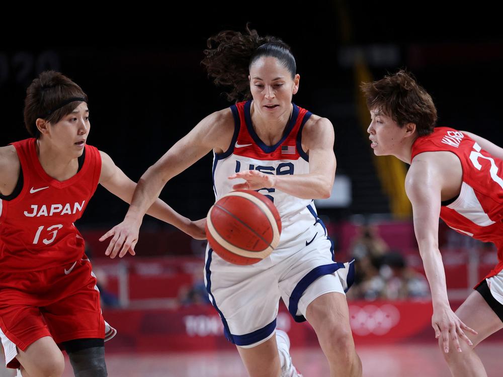 USA's Sue Bird dribbles the ball past Japan's Rui Machida (L) against Japan. The U.S. hasn't lost a game at the Olympics since 1992.