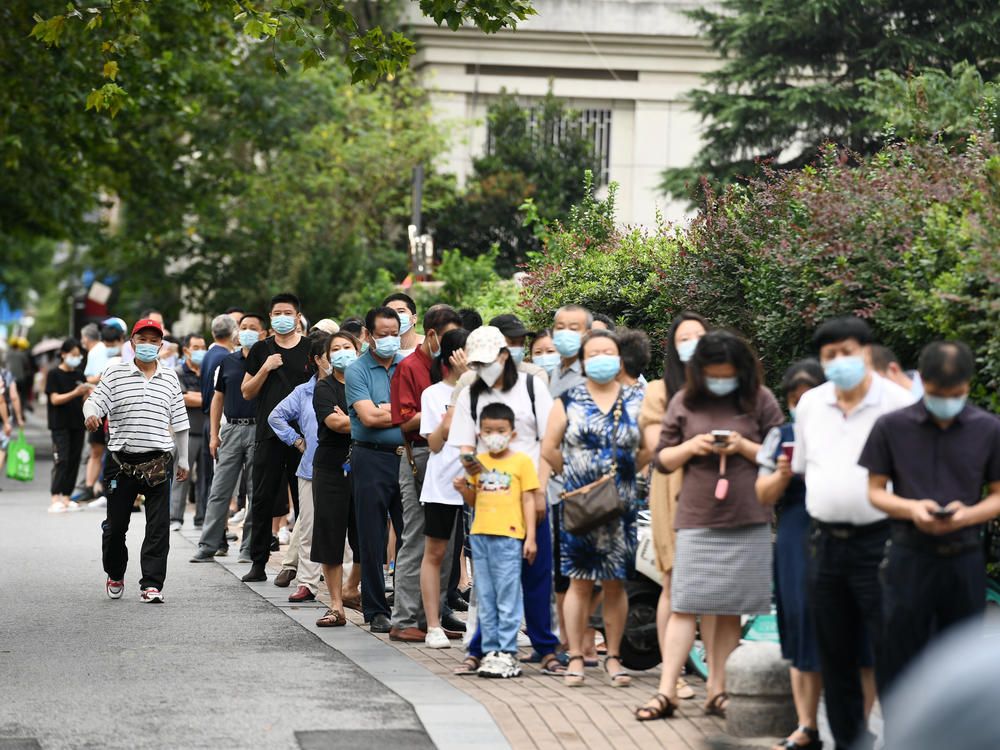 People line up for coronavirus testing on Thursday in Nanjing, in China's Jiangsu province.
