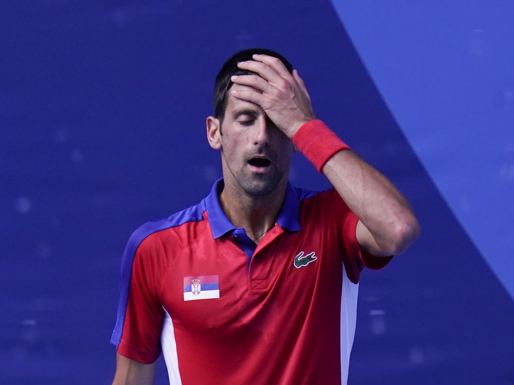 Novak Djokovic of Serbia reacts during the bronze medal match that he lost to Spain's Pablo Carreño Busta at the Tokyo Olympics on Saturday.