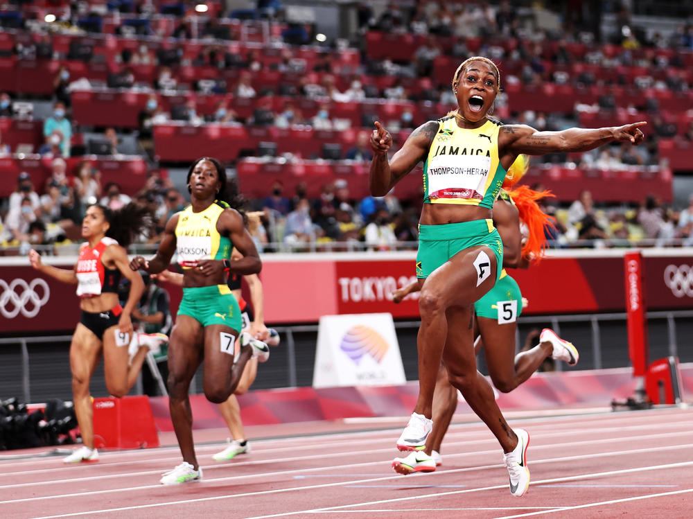 Elaine Thompson-Herah of Team Jamaica crosses the finish line to win the gold medal in the women's 100-meter final at the Tokyo Olympic Games on Saturday.