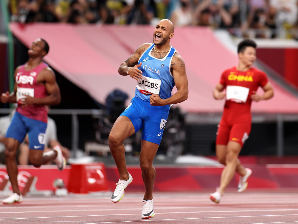 Italy's Marcell Jacobs celebrates after winning the men's 100 meter final at the Tokyo Olympic Games.