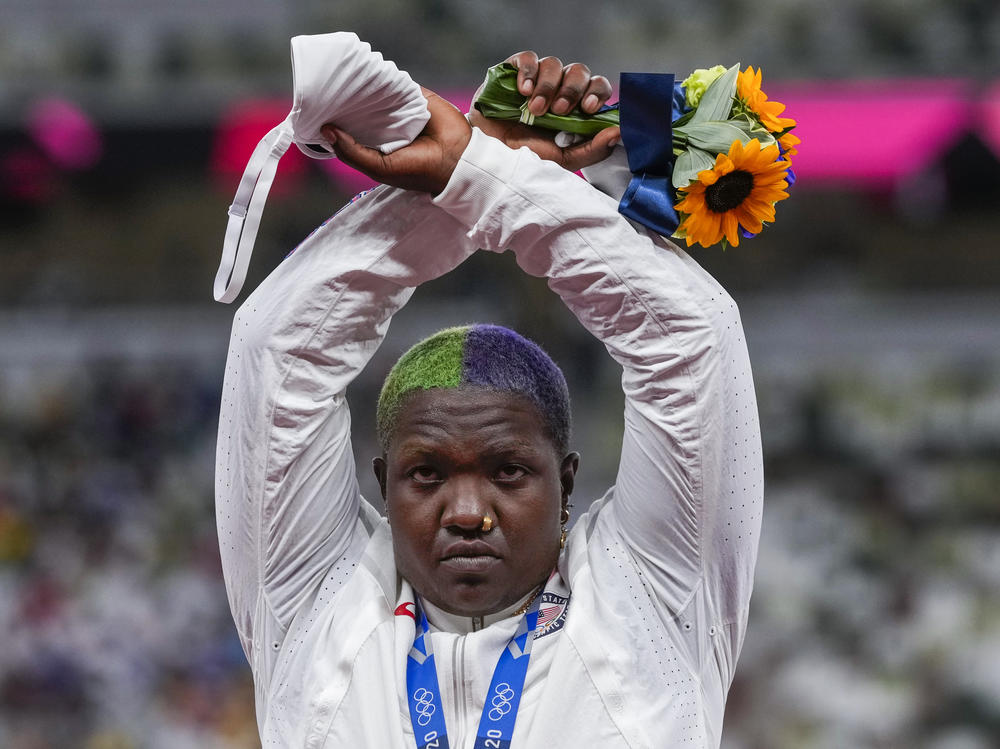 U.S. shot putter Raven Saunders poses with her silver medal on Sunday and lifted her arms above her head and formed an X with her wrists. Asked what that meant, she explained, 