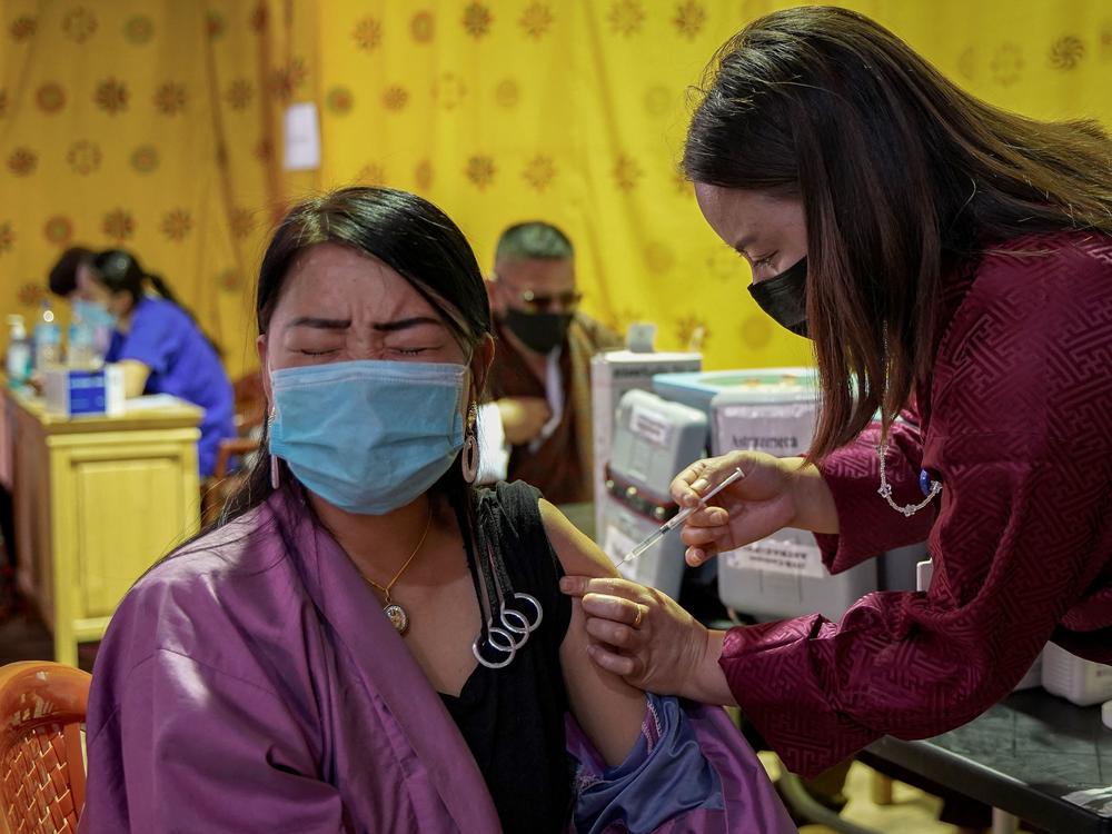 A health worker vaccinates a woman in Thimpu, Bhutan on July 26.