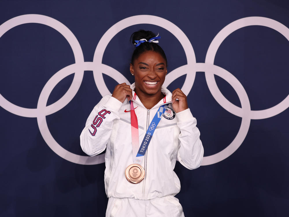 U.S. gymnast Simone Biles won a bronze medal Tuesday in the women's balance beam final at the Tokyo Olympic Games.