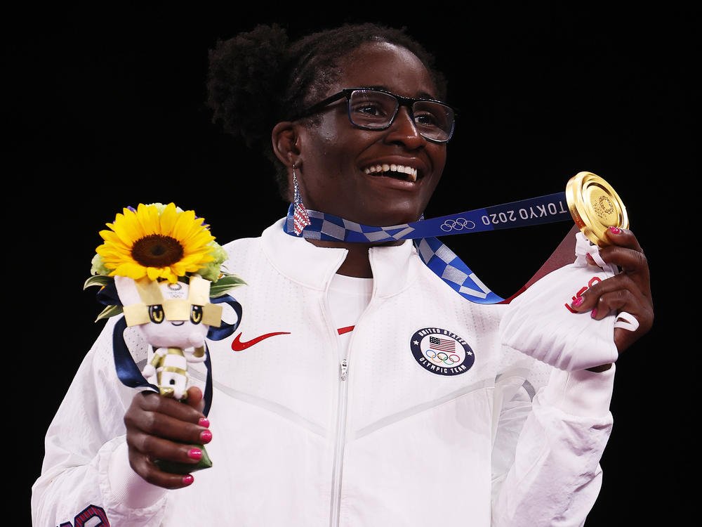 Team USA's Tamyra Mensah-Stock displays her gold medal Tuesday after the women's 68-kilogram freestyle wrestling final at the Tokyo Olympics.