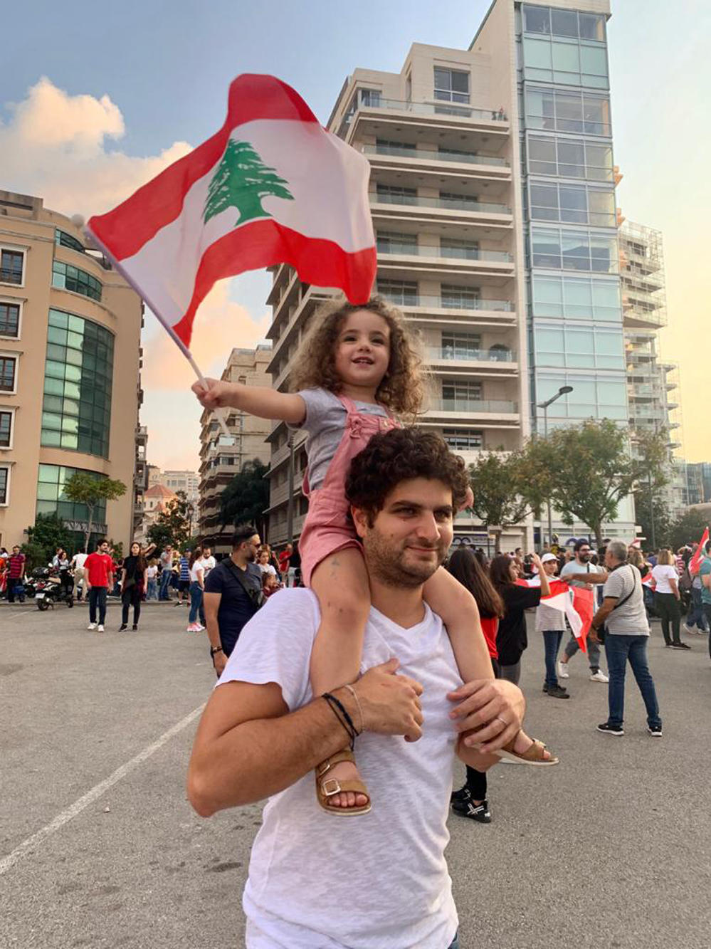 Paul Naggear holds his daughter Alexandra on his shoulders in 2019. Alexandra never regained consciousness after the blast and later died in the hospital.
