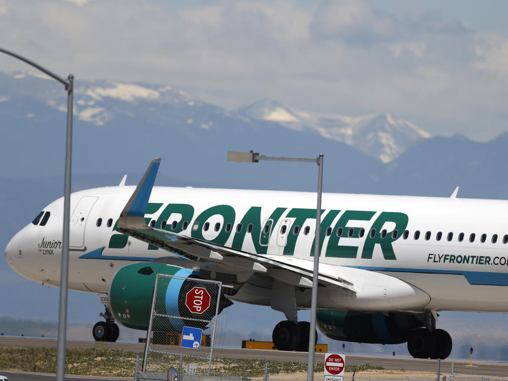 A Frontier Airlines aircraft at Denver International Airport in 2020. A 22-year-old passenger faces three misdemeanor charges after allegedly groping two flight attendants and assaulting a third.