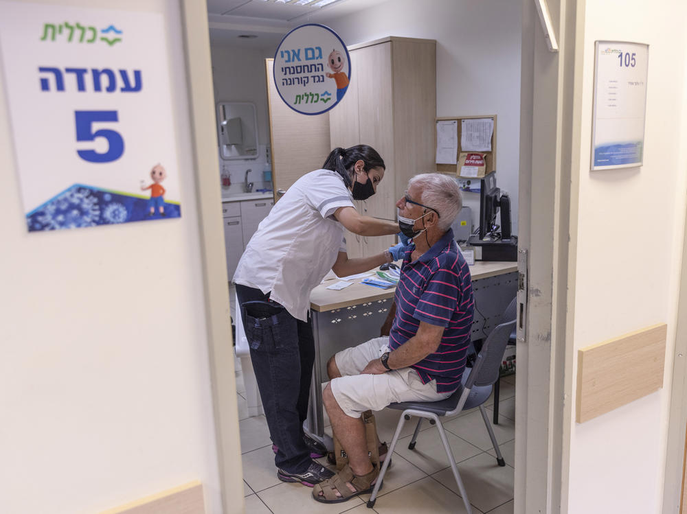 The director of WHO now says that a booster moratorium should be in force until 10% of the population in all countries is vaccinated. Israel had previously announced plans to give a third Pfizer dose to residents age 60 and up after an uptick in COVID cases. Above: Administering a booster on August 2 in Tel Aviv.