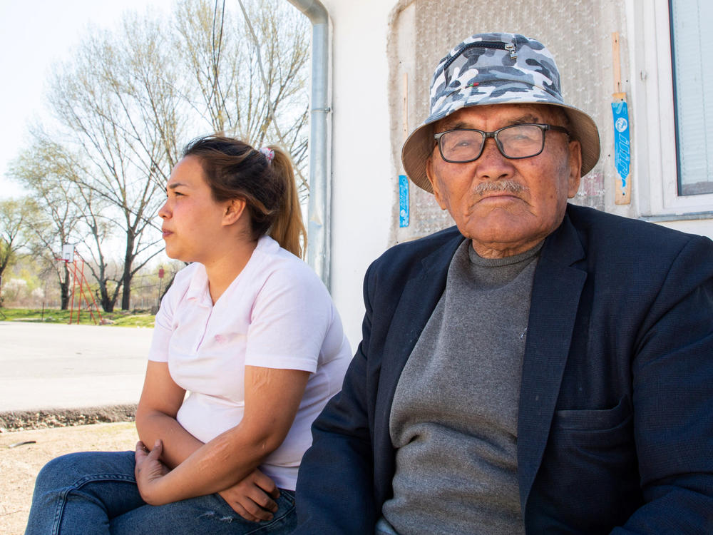 Afghan Masouma Musavi, 24, and her father Reza Musavi, 85, sit in the Krnjaca asylum center near the Serbian capital Belgrade. They arrived in the country with Masouma's mother and daughter in 2017, after walking across Iran.