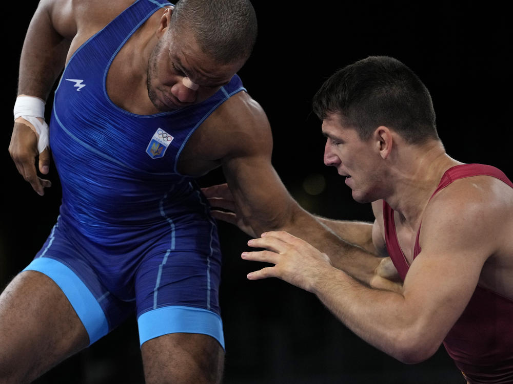 Ukraine's Zhan Beleniuk (left) and Hungary's Viktor Lorincz compete during the men's 87-kilogram Greco-Roman wrestling final match at the Olympics on Aug. 4 in Japan.