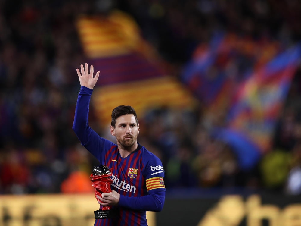 Lionel Messi waves at a Barcelona crowd in 2019. Barcelona says Lionel Messi will not stay with the club.