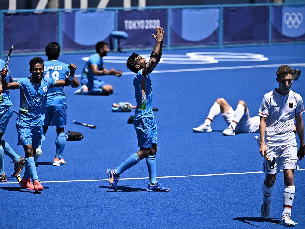 Indian field hockey players celebrate after winning the men's bronze medal match over Germany at the Tokyo Olympics.