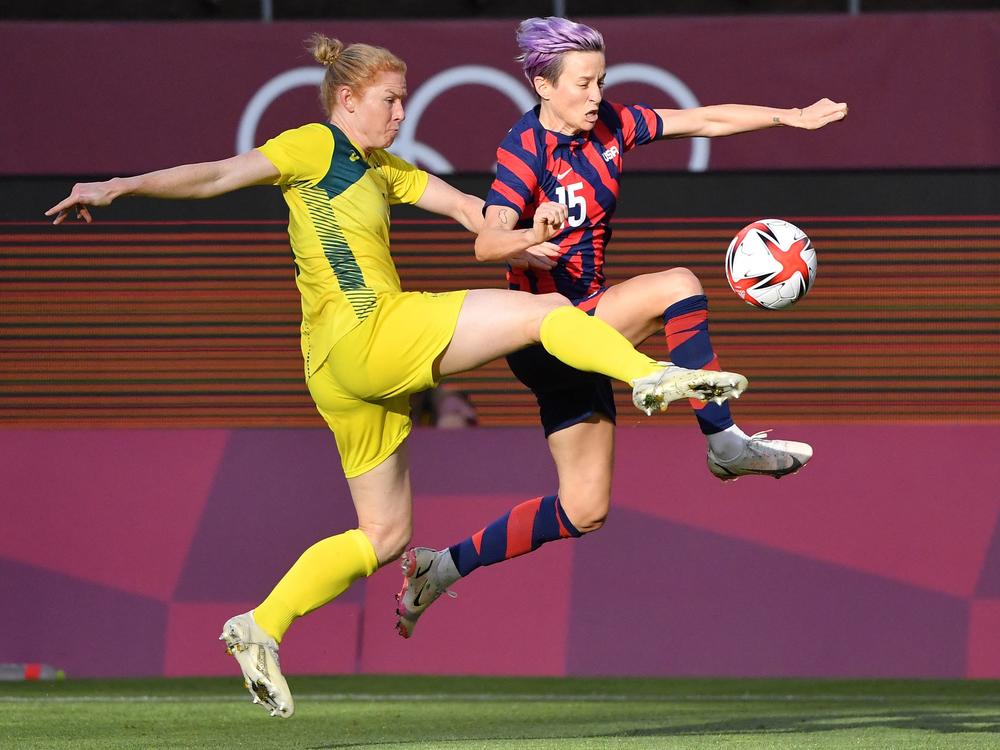 Australia's defender Clare Polkinghorne (left) fights for the ball with Team USA forward Megan Rapinoe during the women's bronze medal soccer match on Thursday at the Tokyo Olympics.