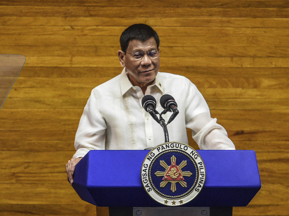 Philippine President Rodrigo Duterte delivers a state of the nation address at the House of Representatives in Quezon City, Philippines, on July 26. Duterte is nearing the end of his six-year term amid a raging pandemic, a battered economy and a legacy overshadowed by a bloody anti-drug crackdown that set off complaints of mass murder before the International Criminal Court.