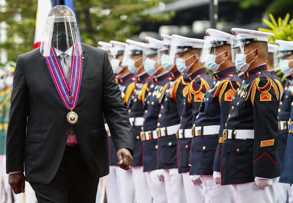 U.S. Defense Secretary Lloyd Austin views the Philippine military honor guard at Camp Aguinaldo in Quezon City, Philippines, on July 30.
