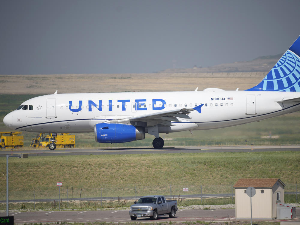 A United Airlines jetliner taxis down a runway for take off from Denver International Airport last month. The carrier has become the first major U.S. airline to require employees be vaccinated against COVID-19.