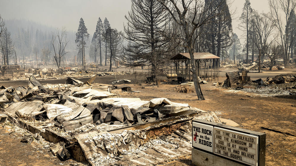 A church marquee stands among buildings destroyed by the Dixie Fire in the Sierra Nevada town of Greenville on Thursday.