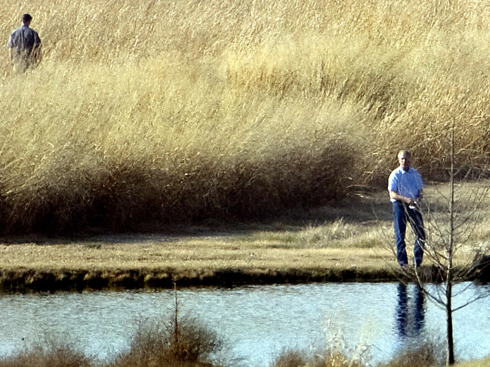 President George W. Bush fishes on a pond on his Crawford, Texas, ranch in 2008.