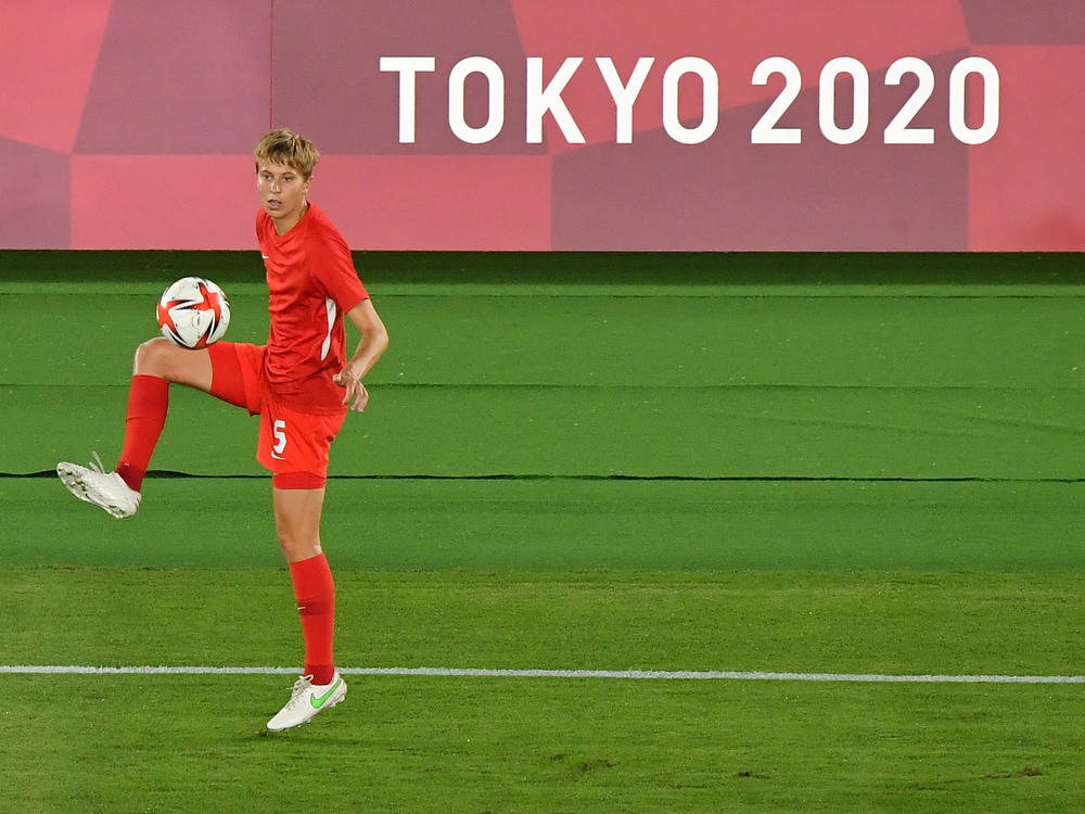 Canada's midfielder Quinn warms up prior to the Tokyo Olympics women's final soccer match between Sweden and Canada on Aug. 6.