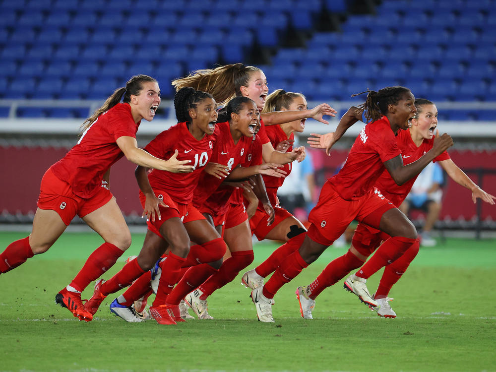 Canada celebrates after defeating Sweden to win gold in the women's soccer final at the Tokyo Olympics.