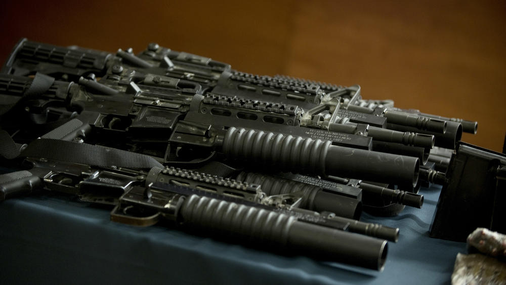 U.S.-made M4A1 rifles with grenade launchers, part of an arsenal seized from the Jalisco New Generation Cartel in 2012 in Mexico City.