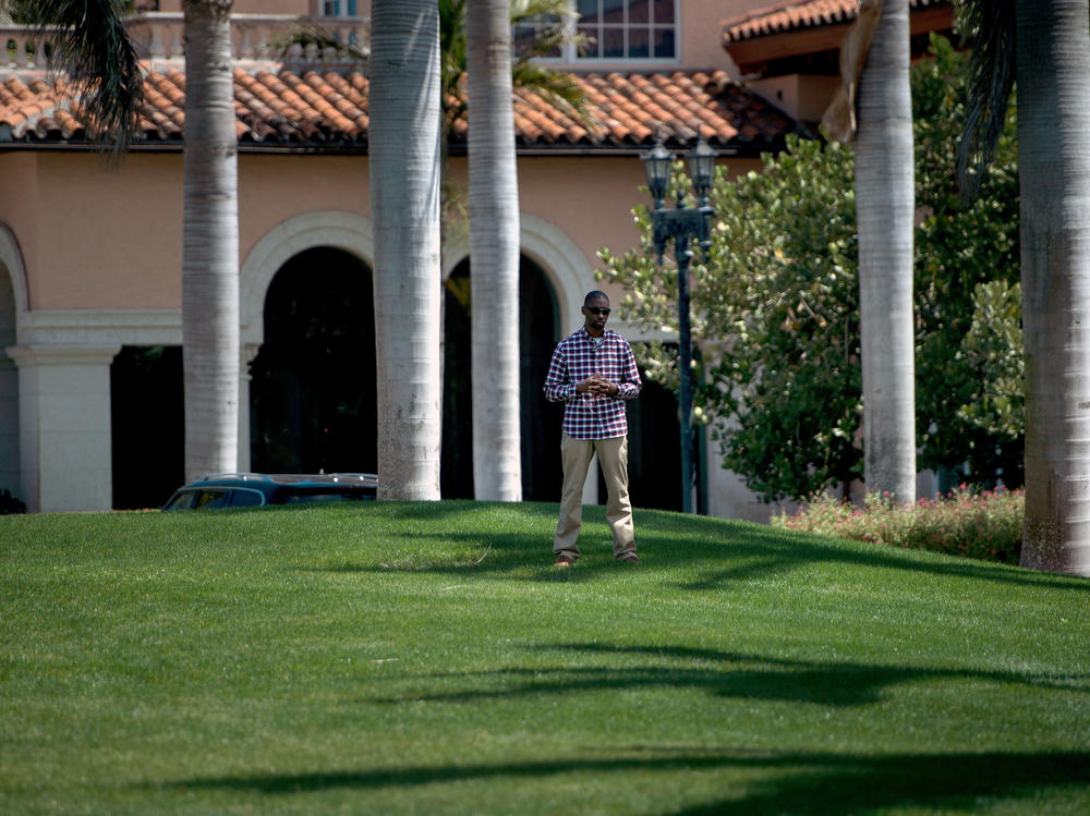 President Donald Trump was criticized for how much money trips to properties he owned cost taxpayers. A member of the Secret Service stands guard at Mar-a-Lago club in Florida in 2018.