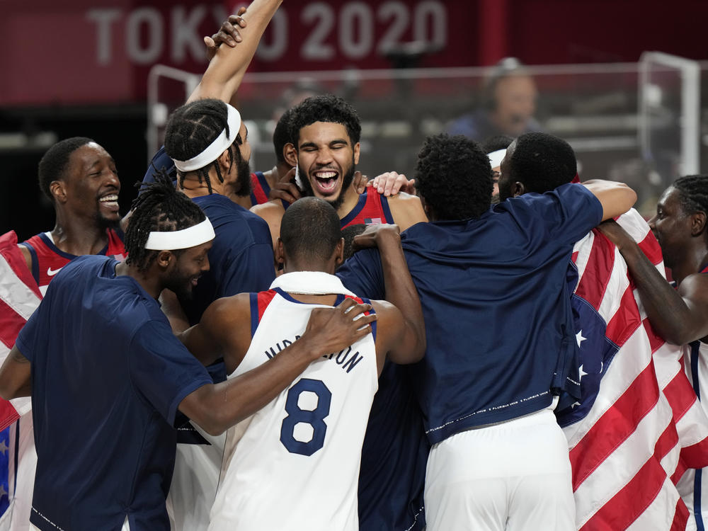 United States' players celebrate after their win in the men's basketball gold medal game against France at the 2020 Summer Olympics on Saturday.