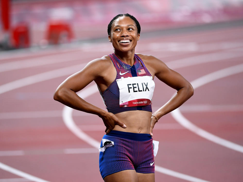 U.S. track star Allyson Felix smiles after winning the bronze medal in the 400 meter race on Friday.