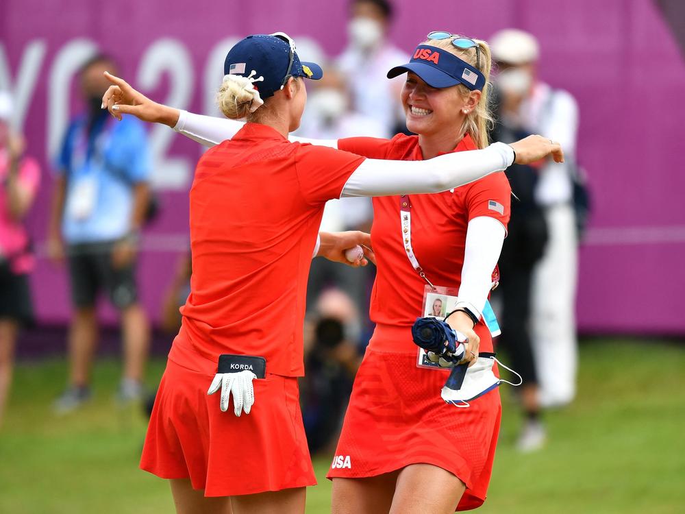 USA's Nelly Korda (L) is congratulated by her sister USA's Jessica Korda (R) after winning the gold medal at the Kasumigaseki Country Club on Saturday.