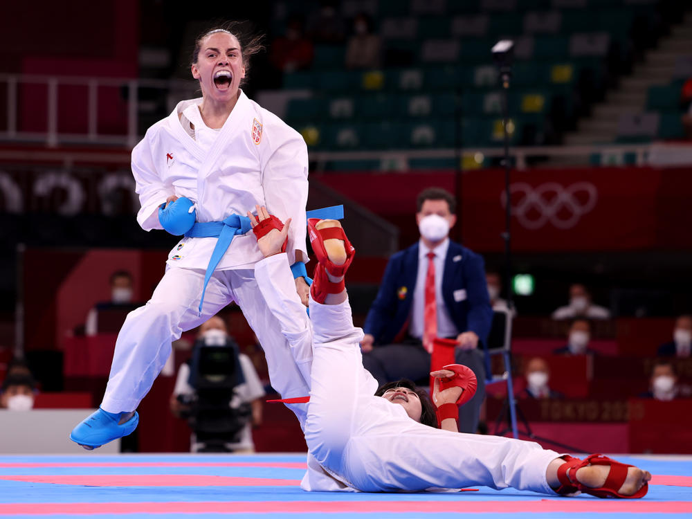 Jovana Prekovic (L) of Team Serbia competes against Yin Xiaoyan of Team China during the Women's Karate Kumite -61kg Gold Medal Bout on Friday at the Tokyo 2020 Olympics.