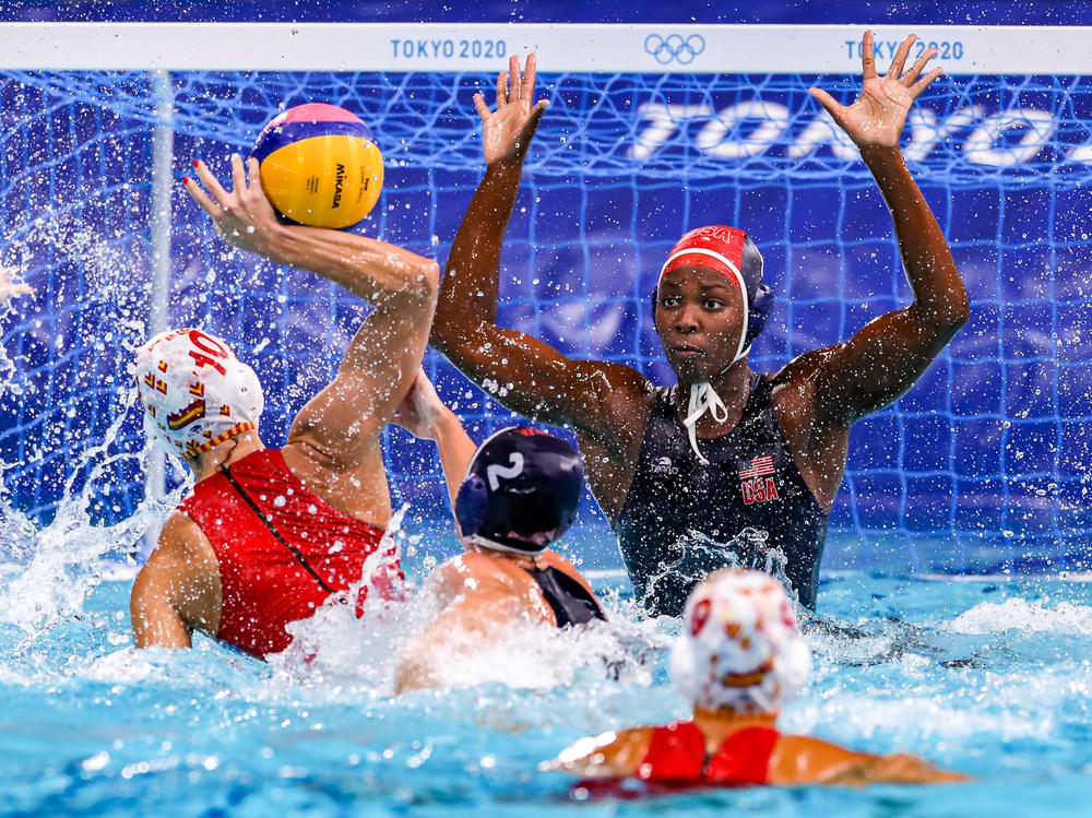 U.S. water polo player Ashleigh Johnson defends a shot during the gold medal match at the Tokyo Olympics.