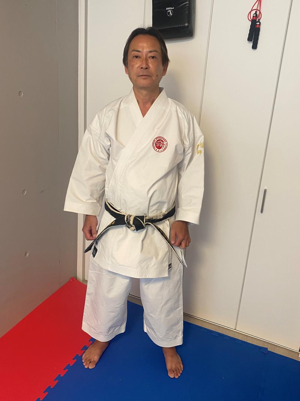 Kenshin Iwata poses inside his dojo in Tokyo. He says in karate, the body is a weapon. 